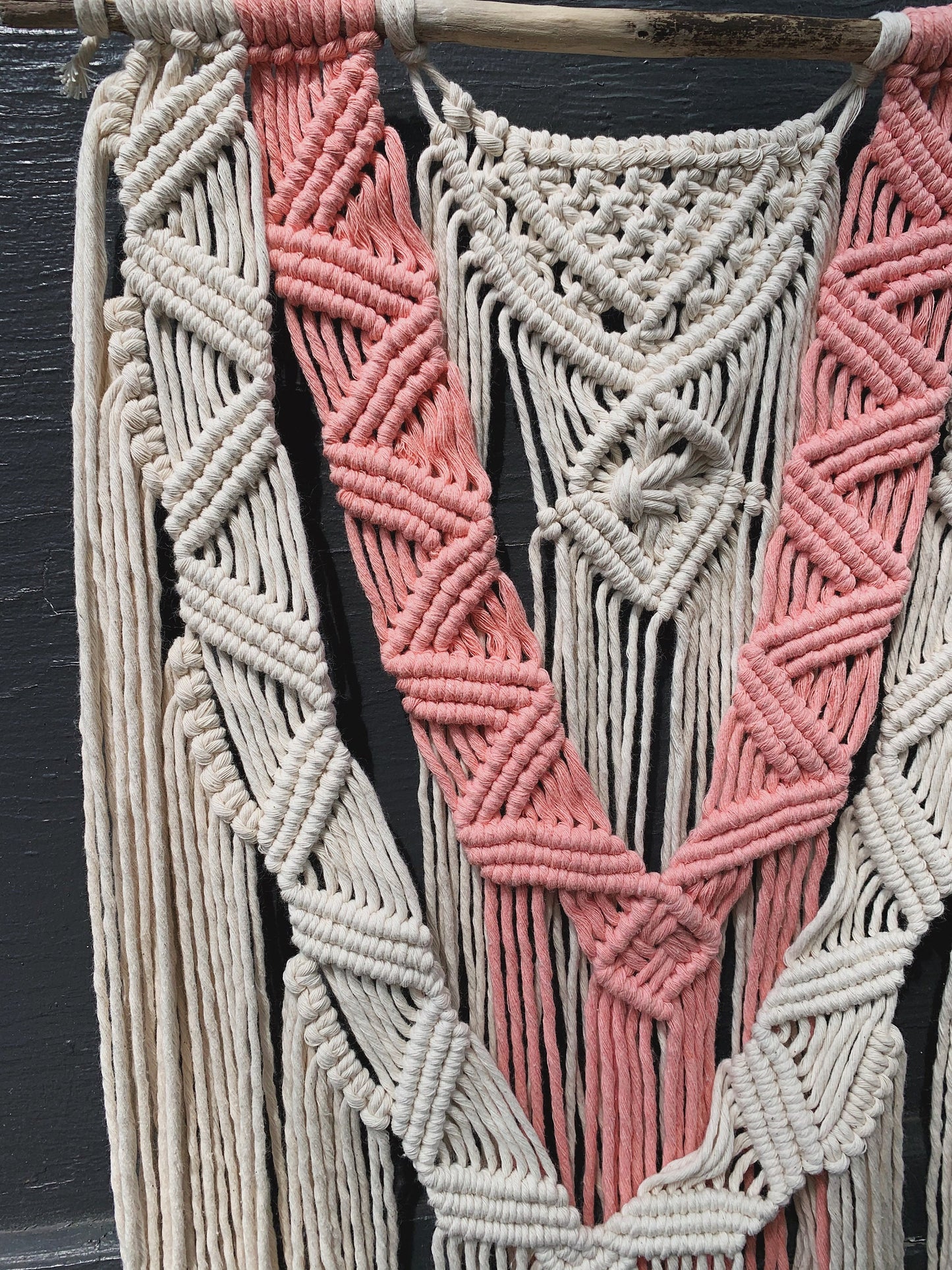 layered coral & natural macrame wall hanging