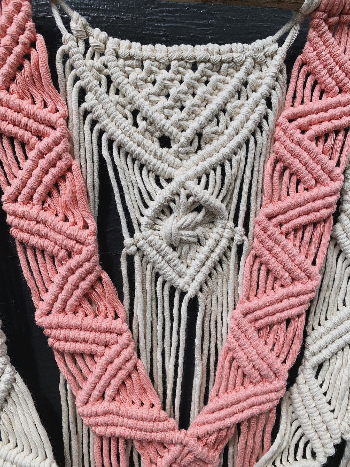 layered coral & natural macrame wall hanging