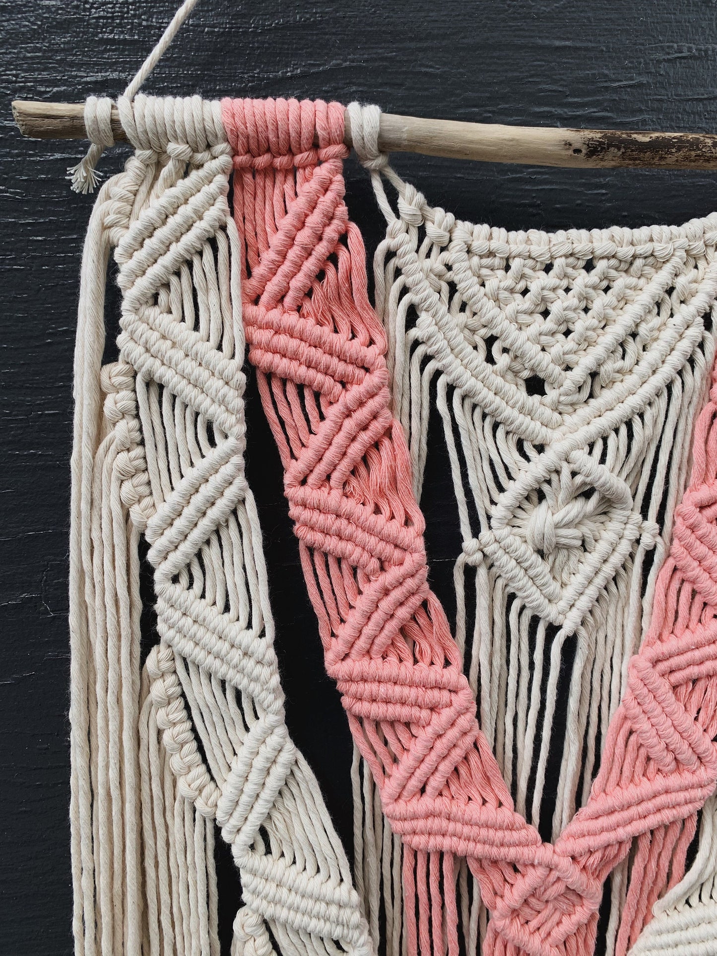 layered coral & natural macrame wall hanging