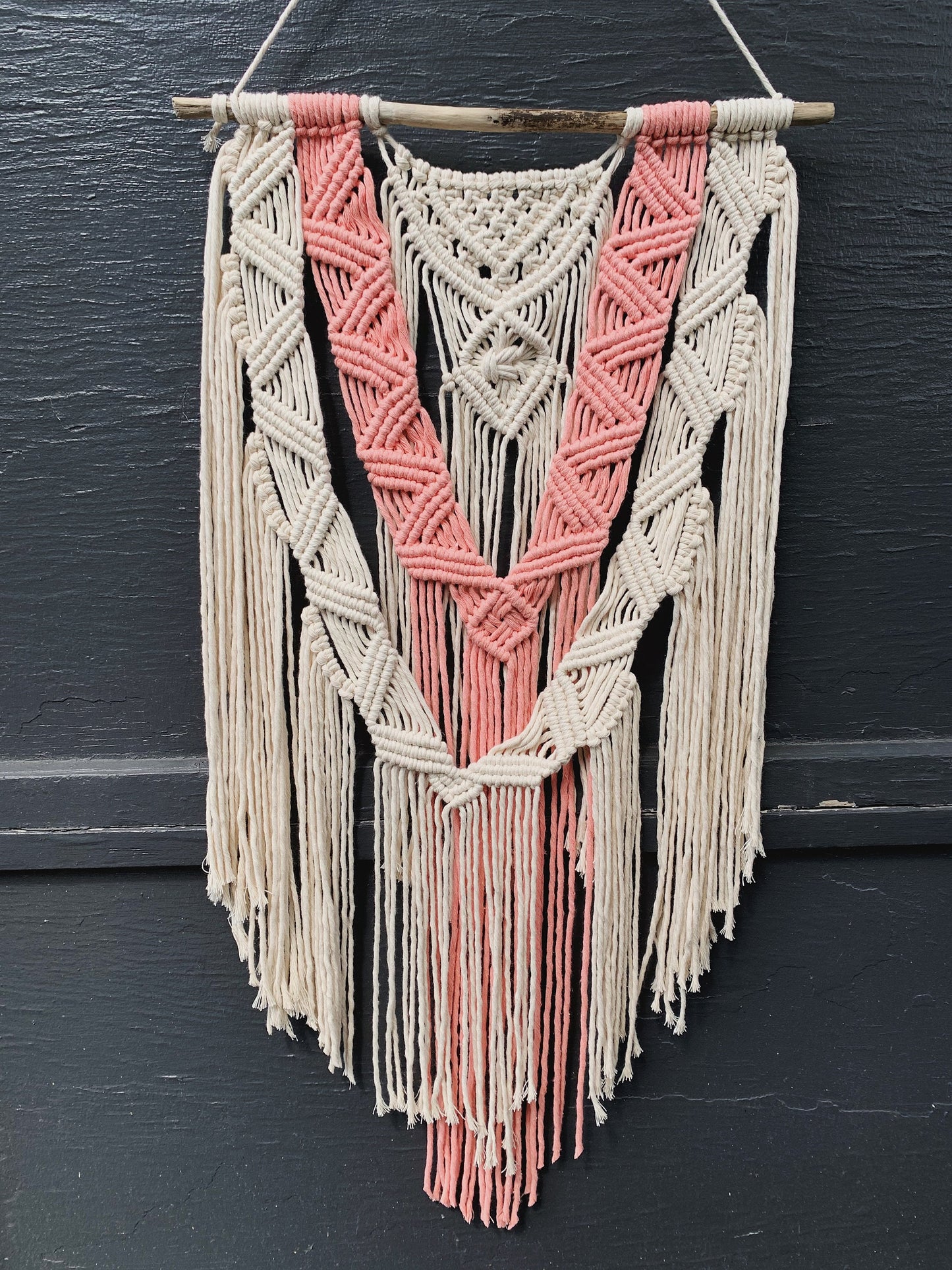 layered coral & natural macrame wall hanging