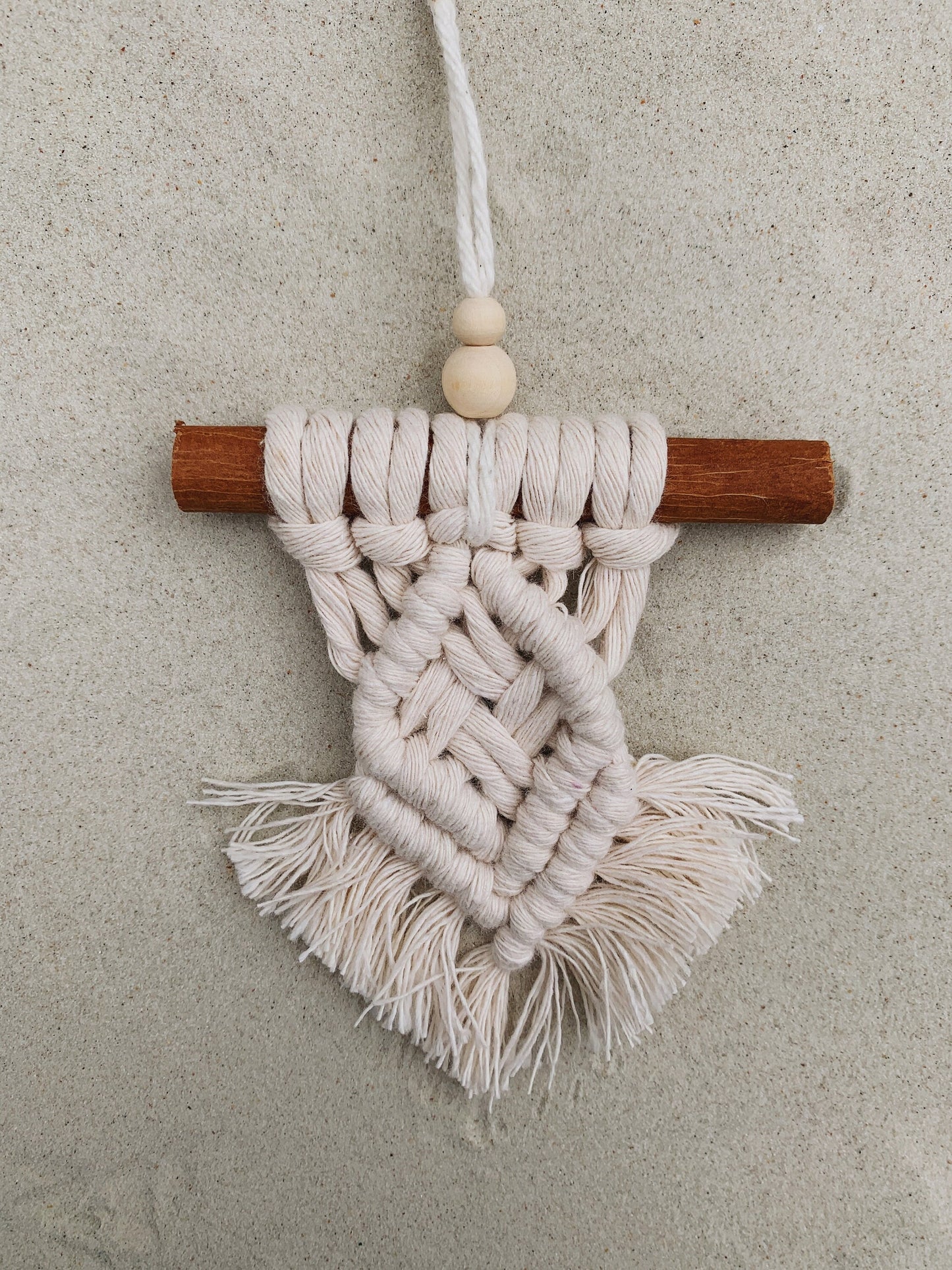 boho macrame ornament with cinnamon stick